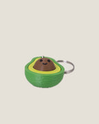3D printed avocado clicker keychain with a smiling seed