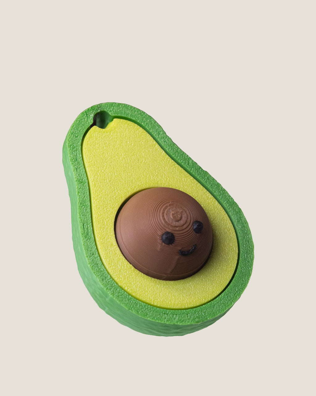 3D printed avocado clicker keychain with a smiling seed