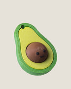 3D printed avocado clicker keychain with a smiling seed