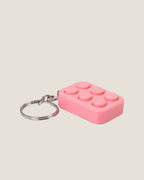 3D printed bubble pop clicker keychains in pink, yellow and blue