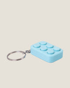 3D printed bubble pop clicker keychains in pink, yellow and blue