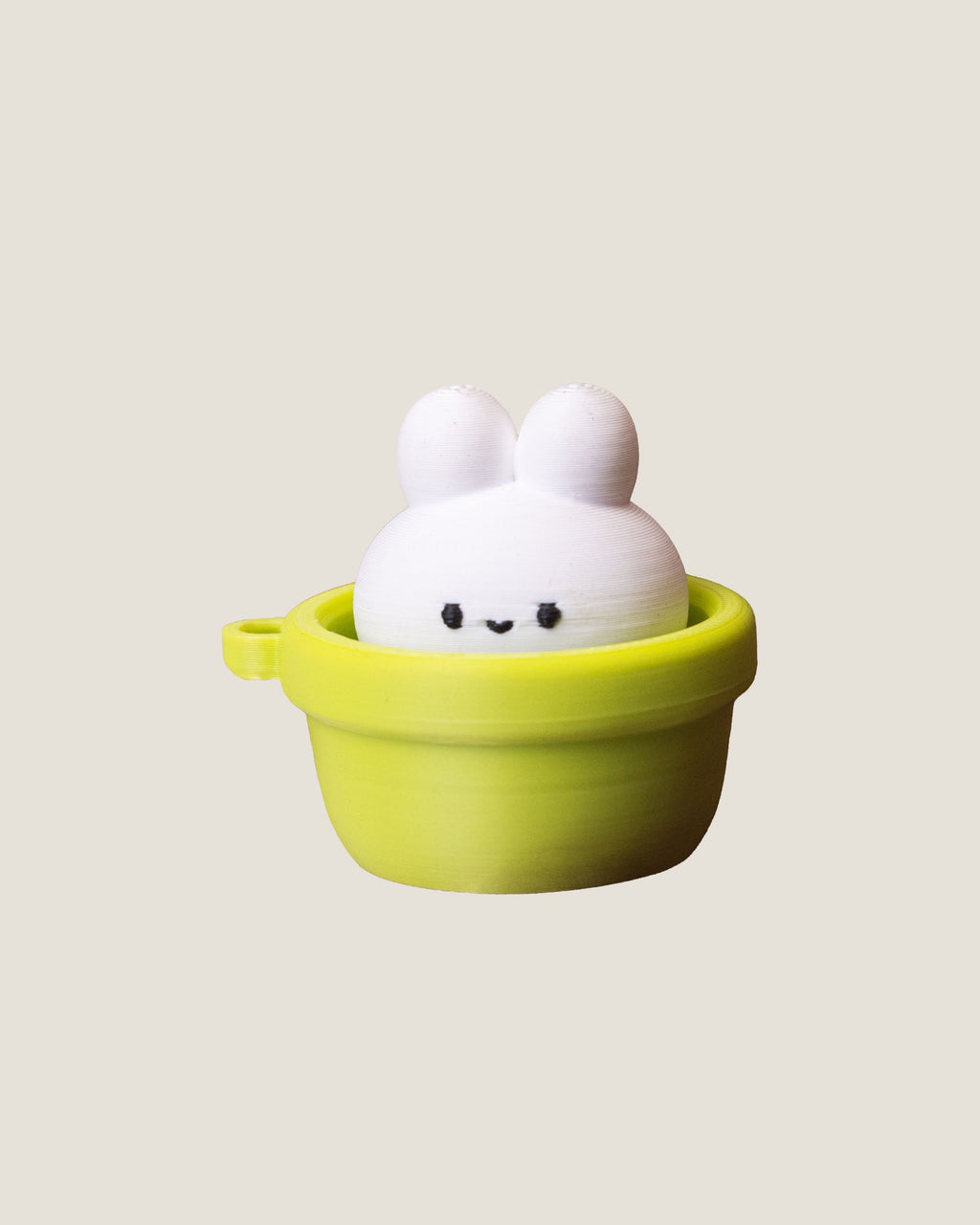 3D printed bunny in a pot clicker keychains in pink and green