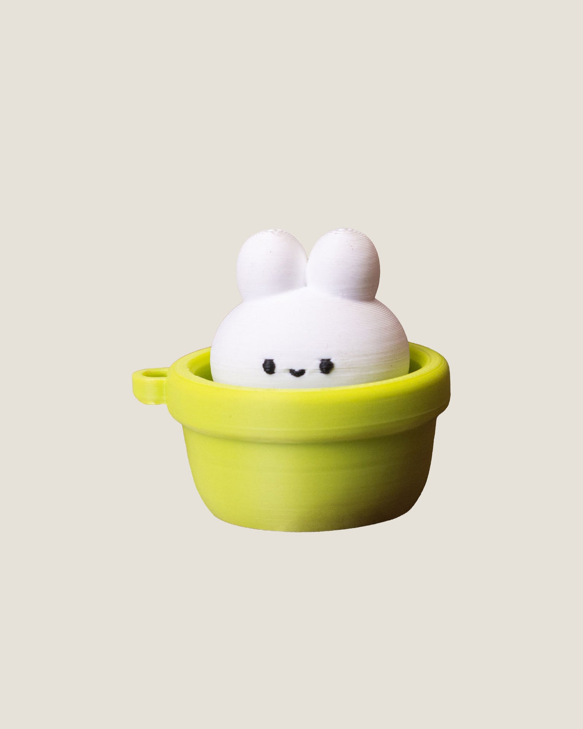 3D printed bunny in a pot clicker keychains in pink and green