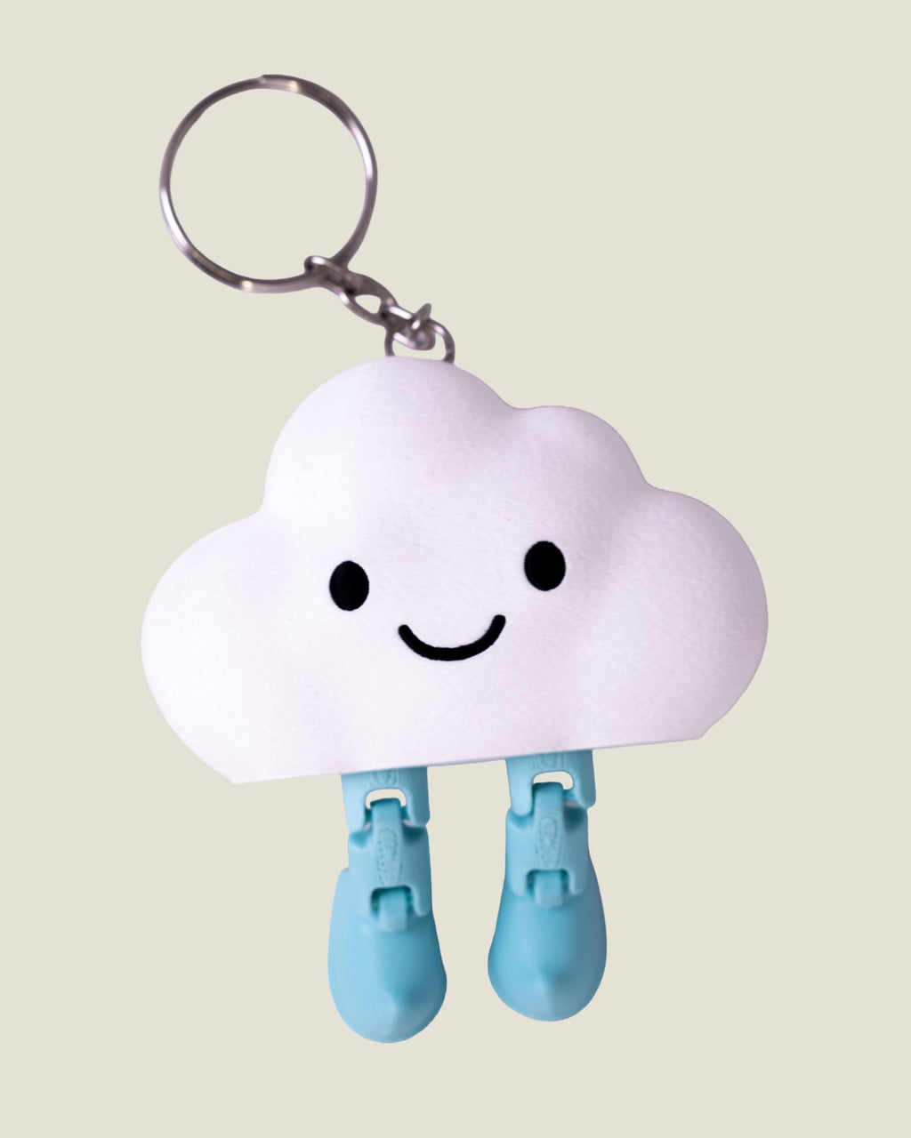 3D printed smiling cloud keychain with jiggly jointed legs