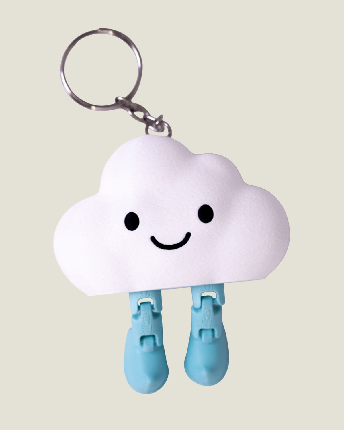 3D printed smiling cloud keychain with jiggly jointed legs