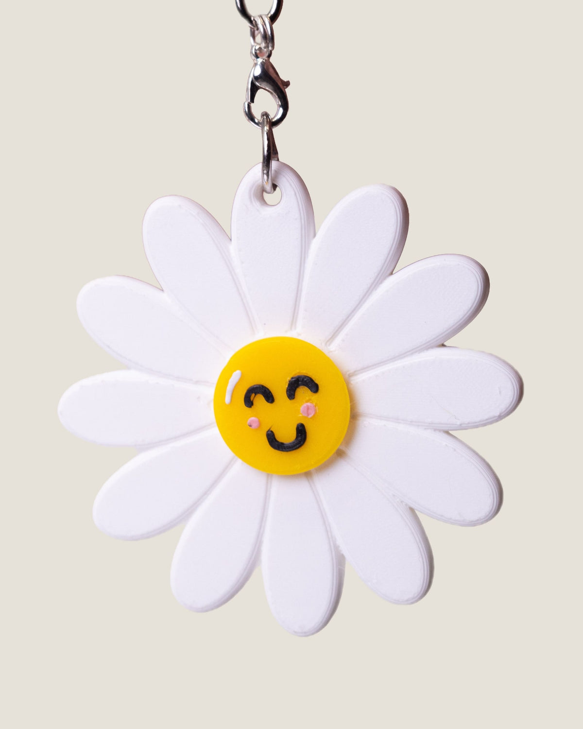 3D printed smiling daisy spinner keychain