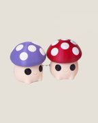 3D printed mushroom clicker keychains in purple, red and pink