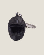3D printed mini motorcycle helmet keychains in yellow, black and grey