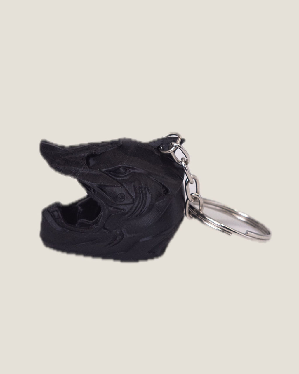 3D printed mini motorcycle helmet keychains in yellow, black and grey