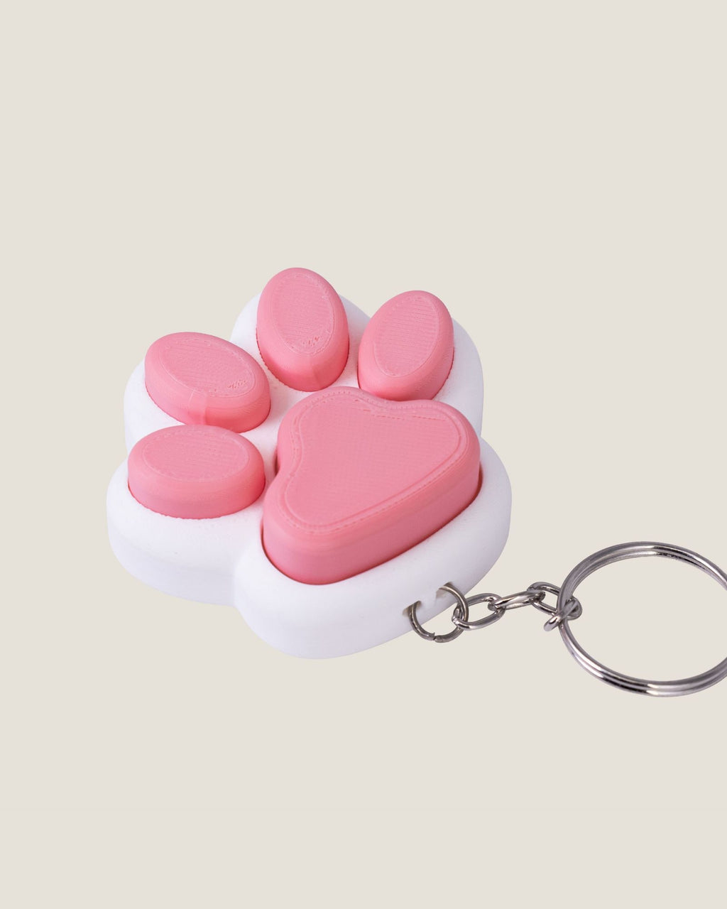 3D printed pink cat paw clicker keychain