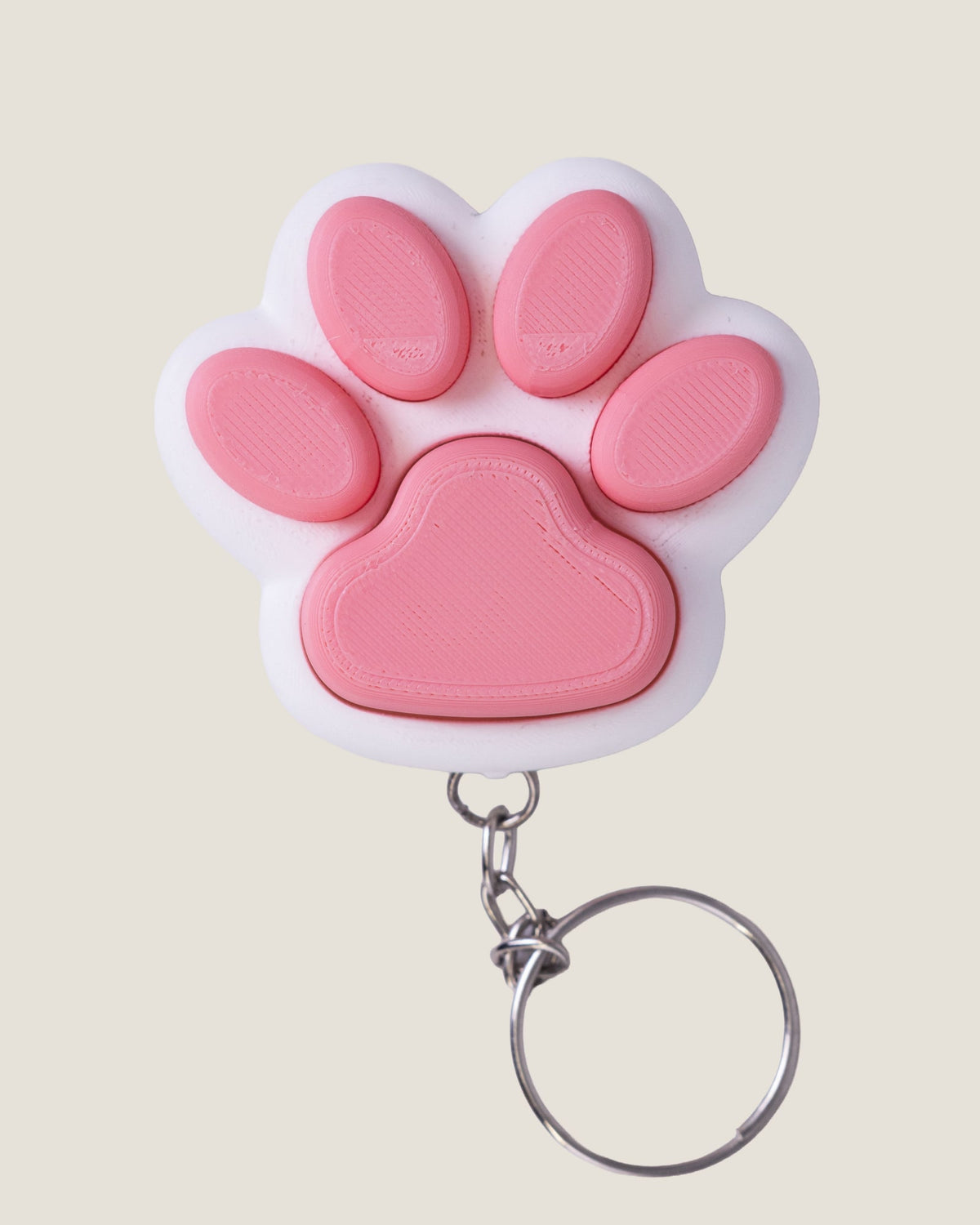 3D printed pink cat paw clicker keychain