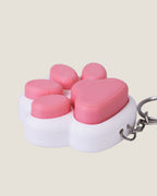 3D printed pink cat paw clicker keychain