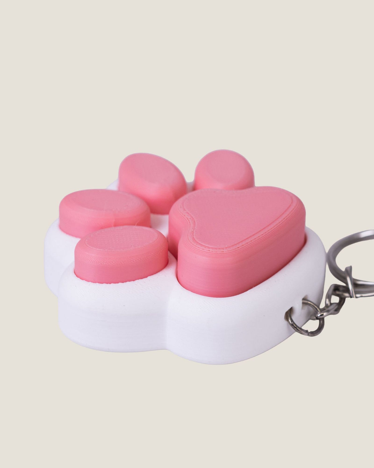 3D printed pink cat paw clicker keychain
